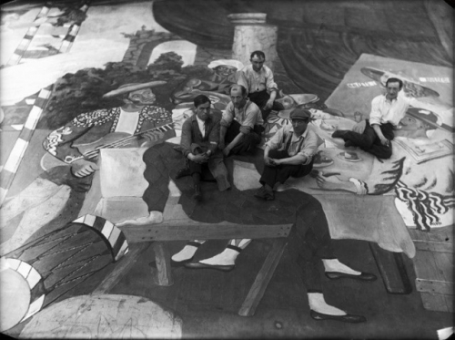 Pablo Picasso (in the beret) and scene painters working on set design for Leonid Massine’s Parade, staged by Serge Diaghilev’s Ballets Russes in Paris, 1917. 