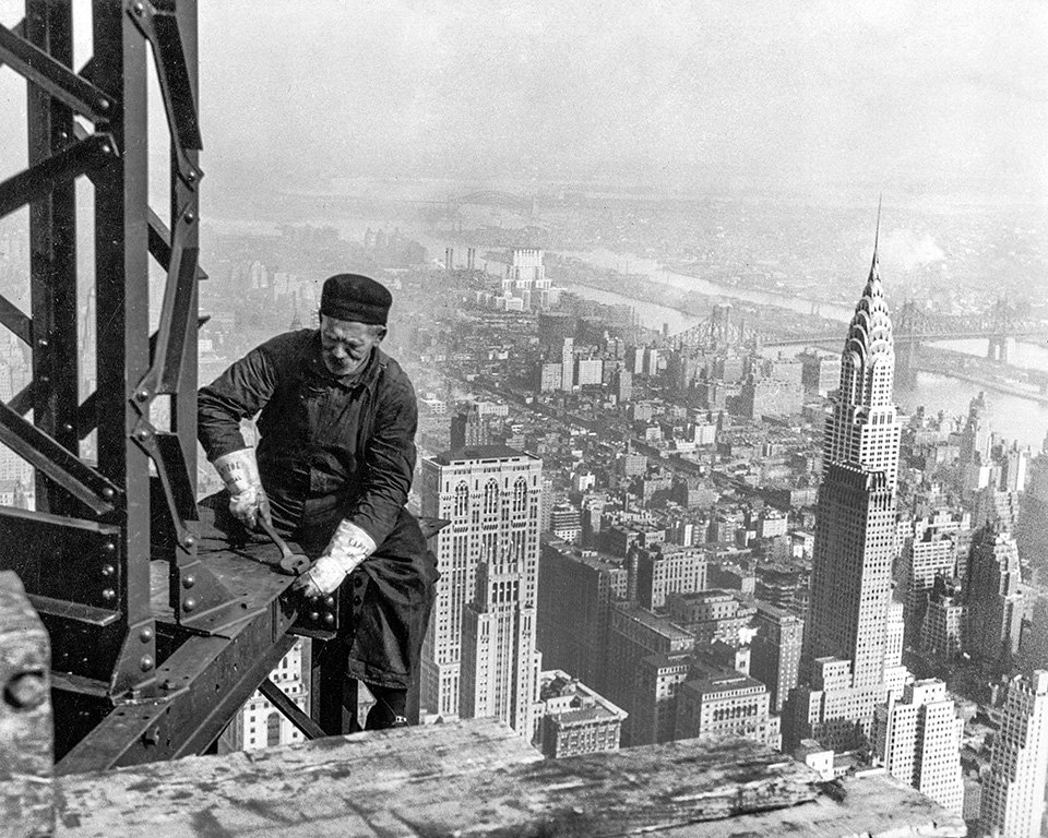 Workman on the framework of the Empire State Building New York City 1931